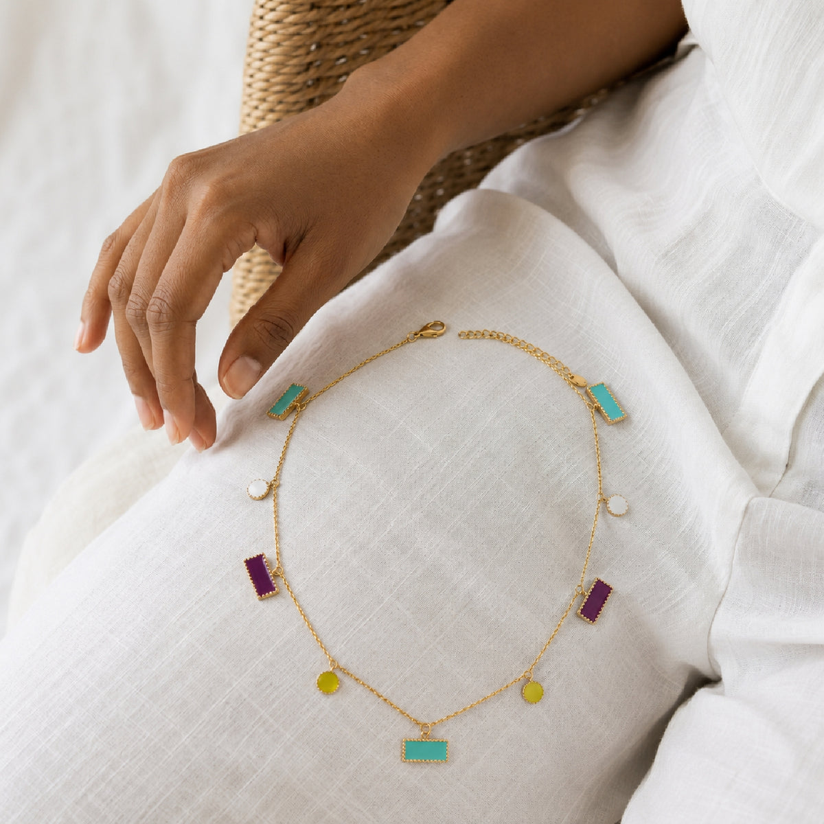 Deco Mosaic gold-plated charm necklace with turquoise, purple, lime green and ivory enamel rectangular and circular charms, worn as a lap shot — Studio Anivarya