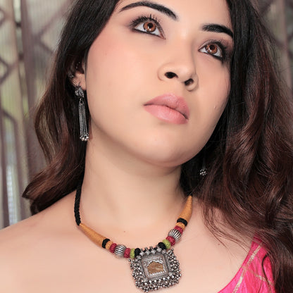 Taveez Handcrafted Silver Necklace with Stamping, Bandhai Threadwork & Gold-Foiled Glass