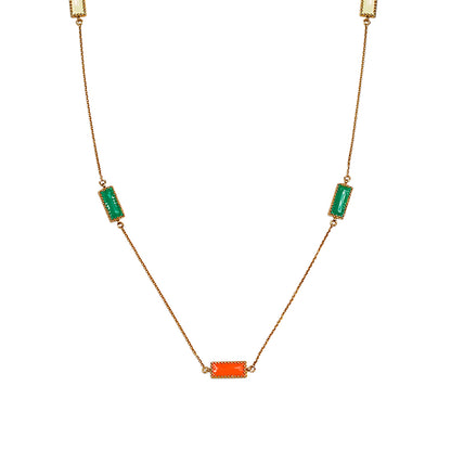 Close-up of Deco Mosaic 18K gold-plated rectangular enamel pendant necklace showing white, orange and green resin enamel detail on white background — Studio Anivarya
