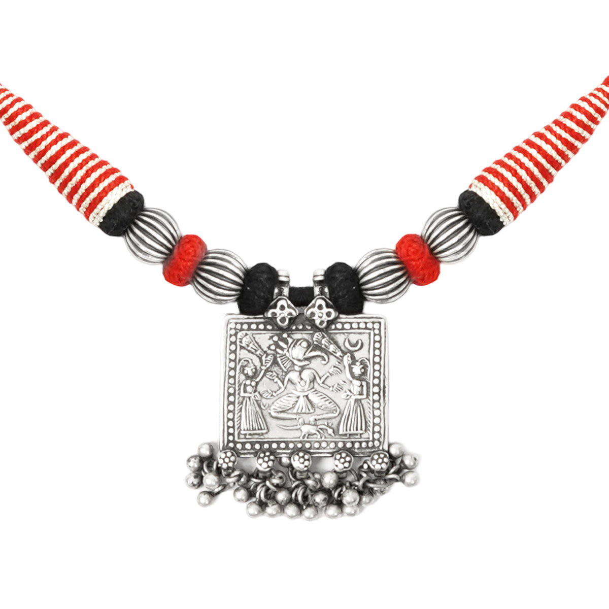 Close-up of Taveez handcrafted silver necklace pendant showing stamped silver detailing, silver beads, and ghungroos with black, red, and silver Bandhai threadwork — Studio Anivarya
